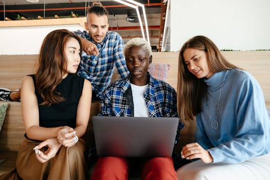 A group of diverse young professionals discussing finances