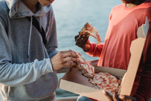 group of friends sharing pizza