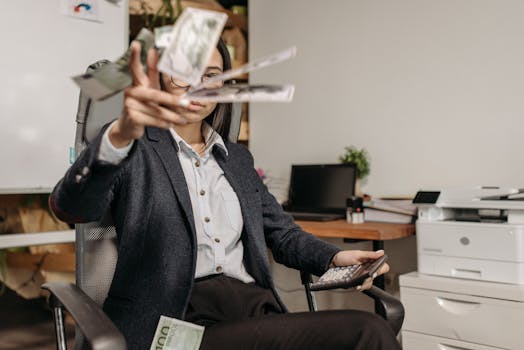 young professional at a desk with financial documents