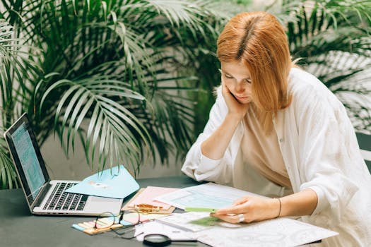 young professional reviewing finances on a laptop