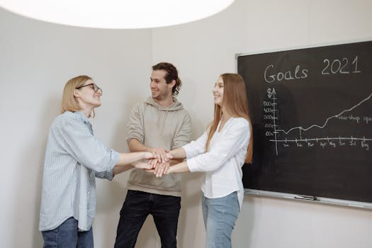 image of a diverse group of young professionals celebrating financial success