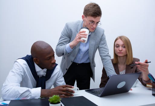 a diverse group of young professionals celebrating their financial success